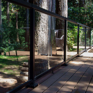 Close-up of the Peak Aluminium Balustrade with large glass panels installed on an outdoor deck.