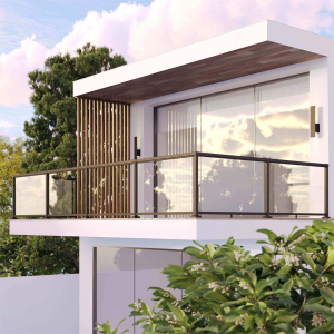 Angled front view of a white modern house with a medium-sized balcony featuring the Peak Aluminium Balustrade system with large glass panels.