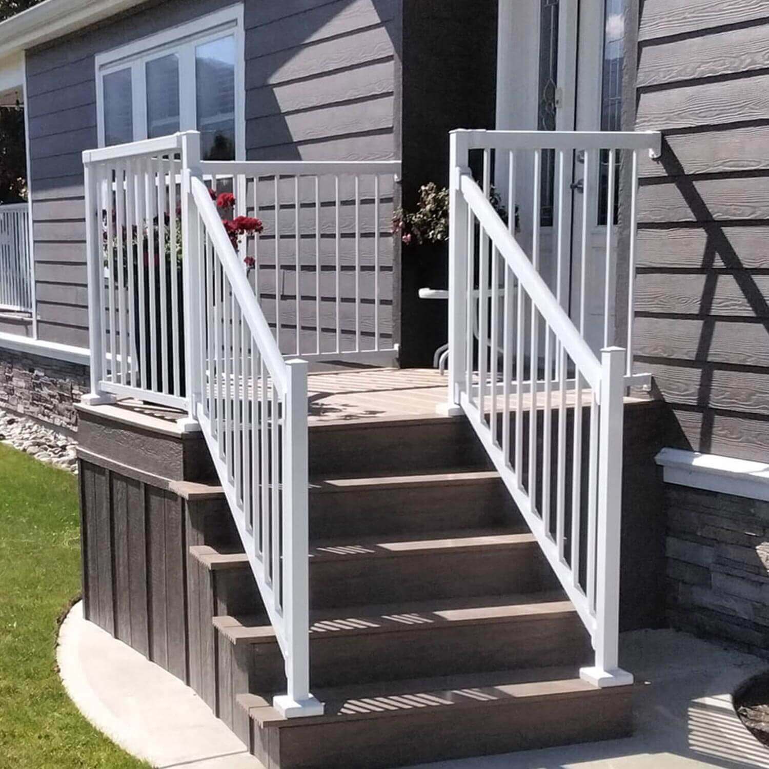 Small front porch deck with stairs featuring the white Peak Aluminium Balustrade.